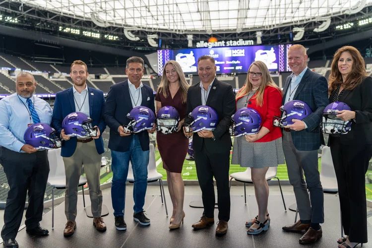 Corporate group with purple helmets at Allegiant Stadium, Las Vegas